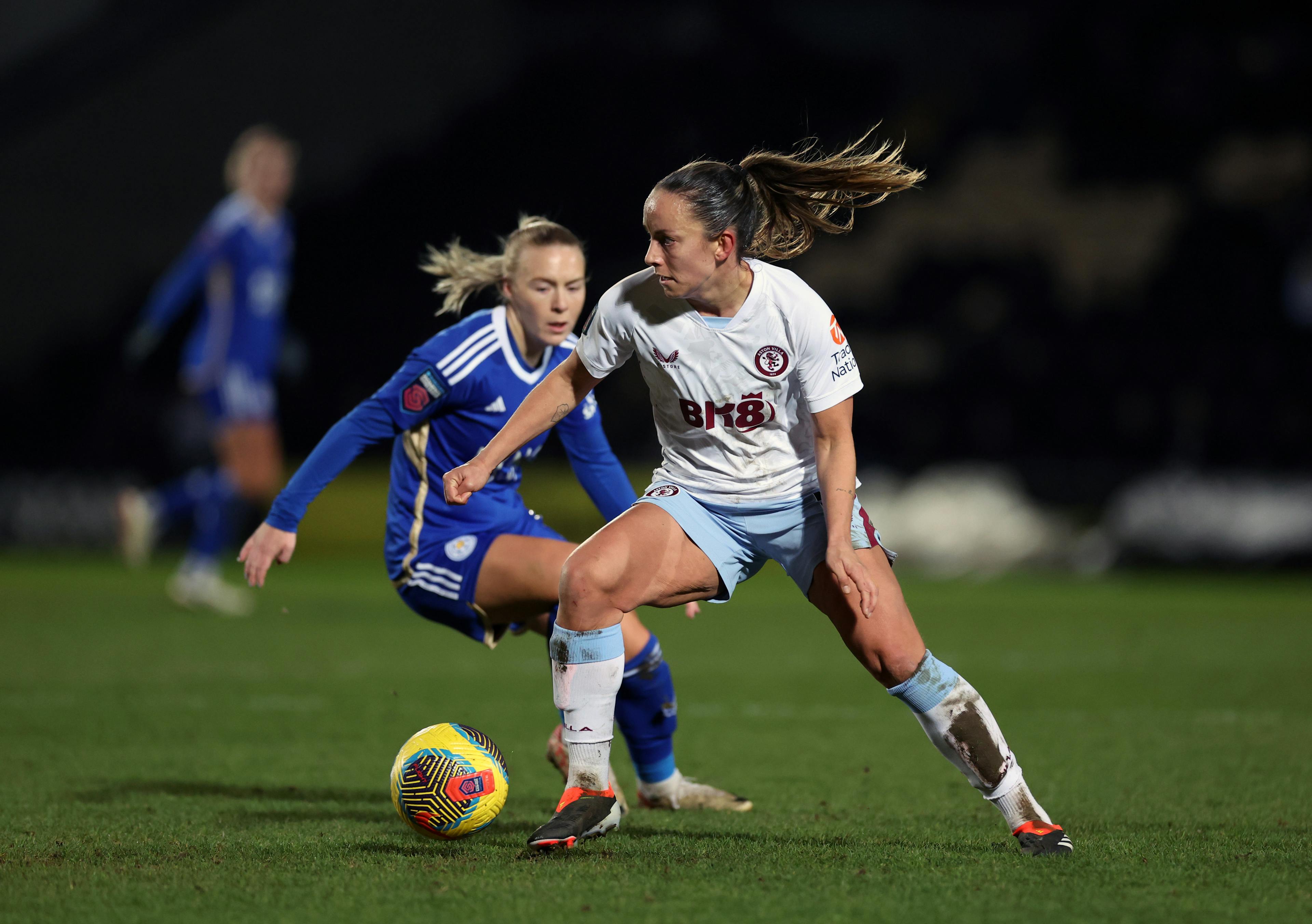 Lucy Staniforth of Aston Villa is challenged by Jutta Rantala of Leicester City